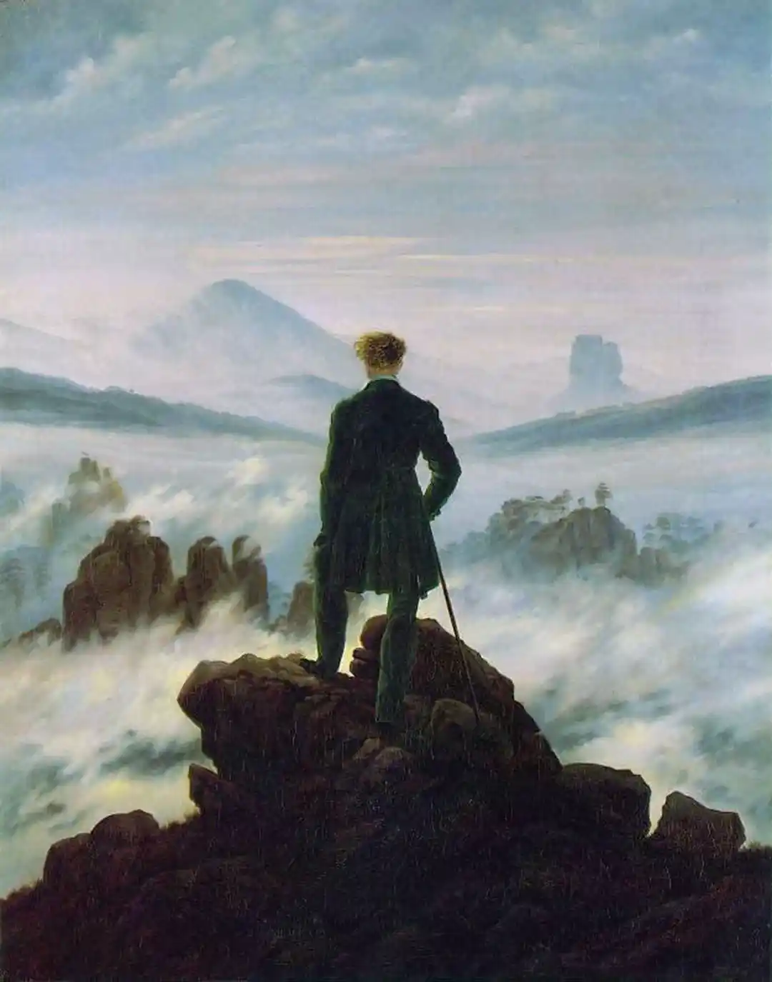 Wanderer above the Sea of Fog — a lone figure looking out over the fog-covered landscape
